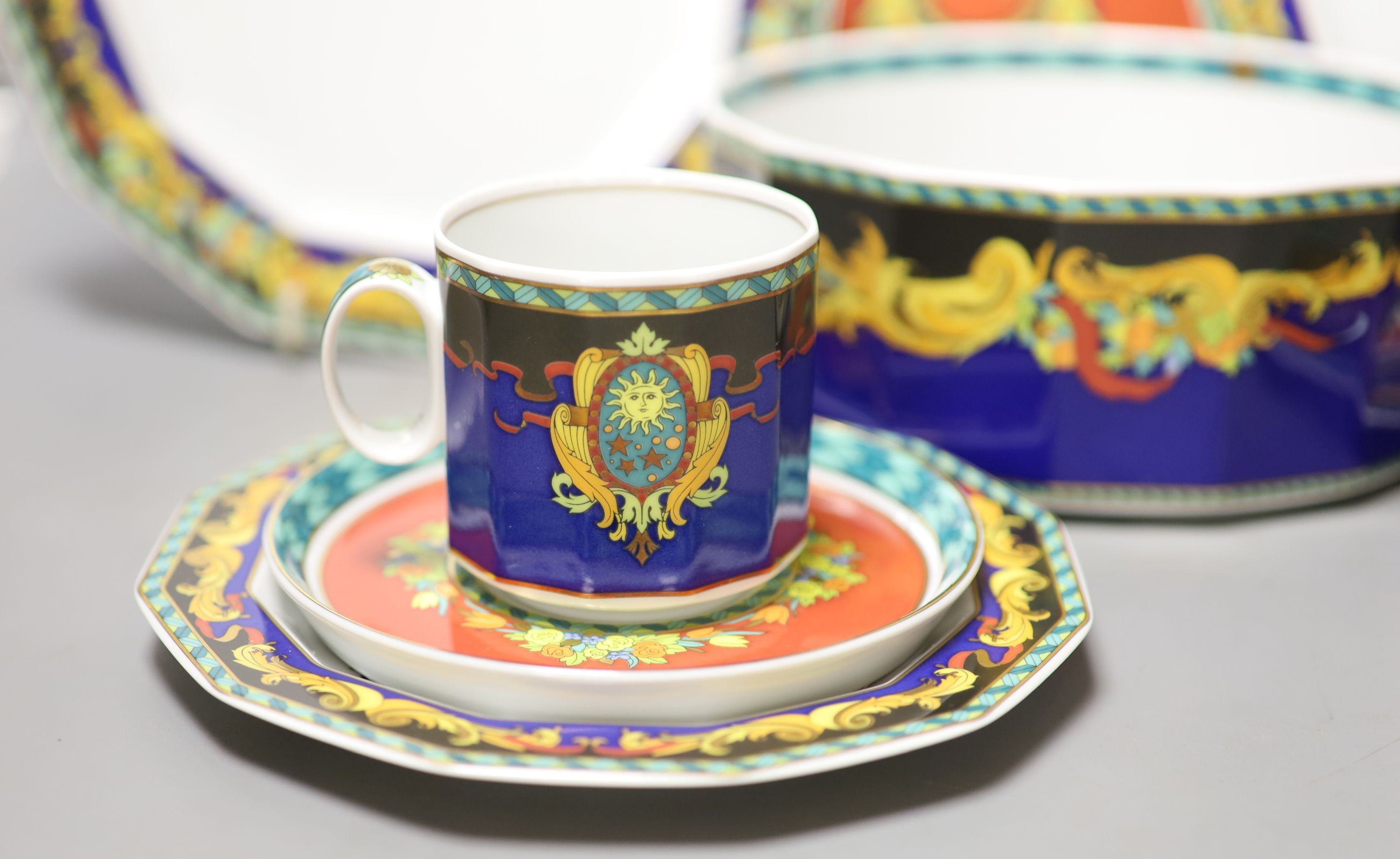 A group of Versace Rosenthal Le Roi Soleil plates and coffee cups and saucers and a bowl, 18.5cm, ten in total